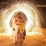 Dramatic night pre wedding photoshoot with colorful smoke and romantic dip pose